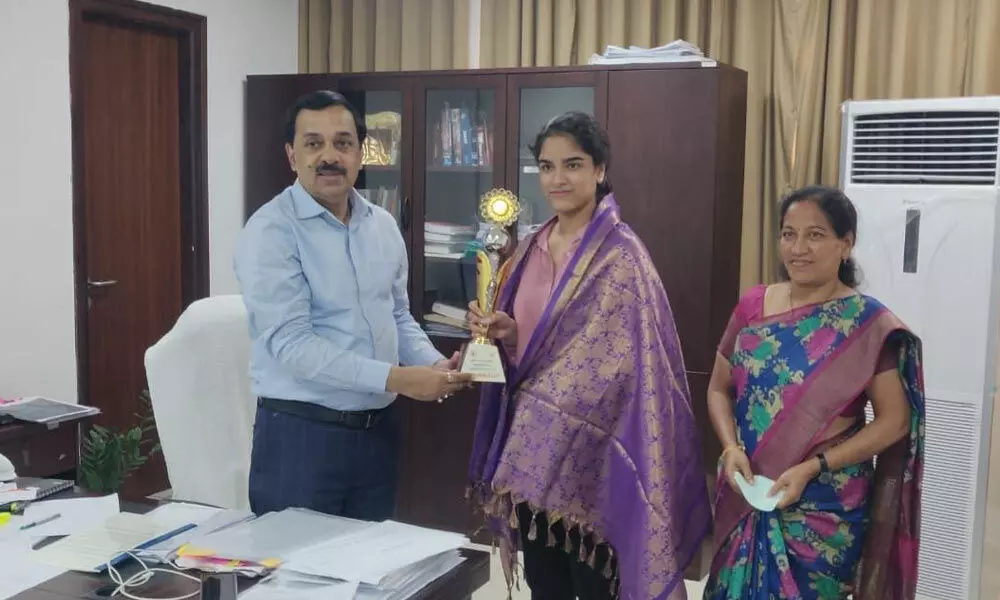 Special Chief Secretary Dr Rajat Bhargava felicitating Woman Grandmaster Priyanka Nutakki at the Secretariat in Velagapudi on Tuesday