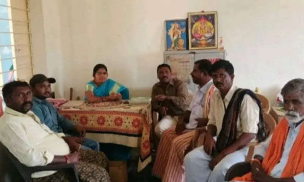 Naulekal village sarpanch Pallavi and Vice MPP Paramesh enquiring about the implementation of midday meals with the headmaster.