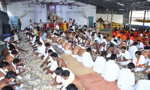 The staff counting hundi collections at Srisailam temple on Wednesday