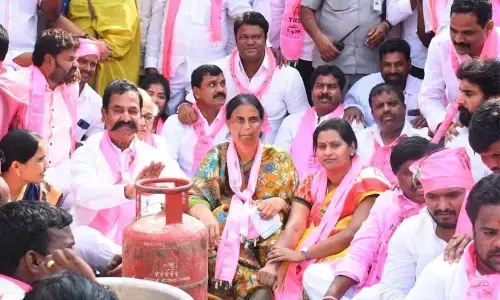 Education Minister Sabitha Indra Reddy along with District ZP chairperson T Anita Harinath Reddy and Maheshwaram former MLA Teegala Krishna Reddy protesting in Rangareddy on Thursday