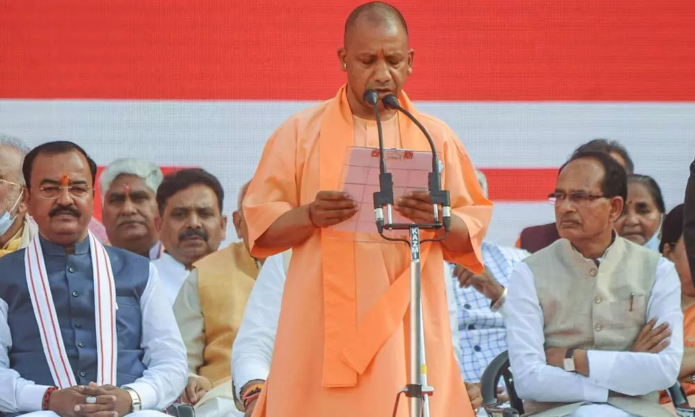 BJP leader Yogi Adityanath takes oath as Uttar Pradesh Chief Minister, for the second consecutive term, at Atal Bihari Ekana Cricket Stadium in Lucknow on Friday