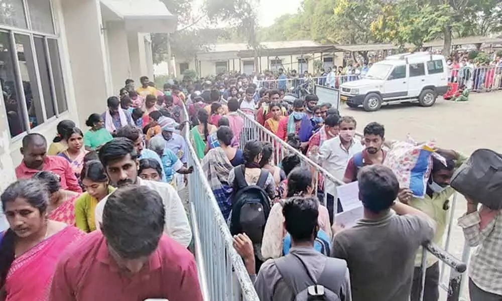 Pilgrims stand in queue lines for Slotted Sarva Darshan (SSD) tokens at Bhudevi complex at Alipiri in Tirupati on Saturday