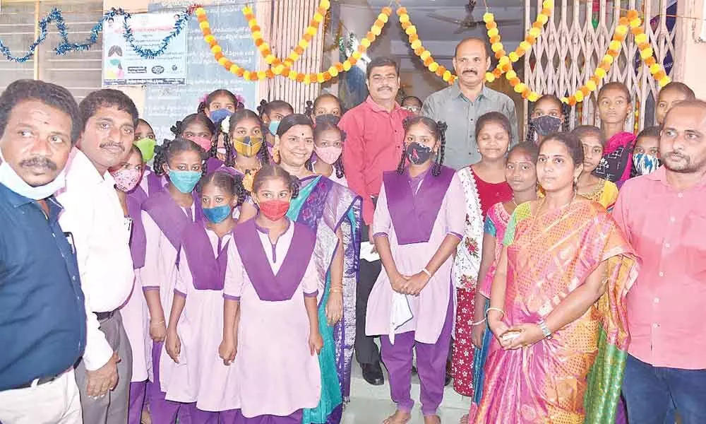 Krishna District Collector J Nivas and MLA K Parthasarathi with students at the inaugural function of the students’ hostel  at Penamaluru on Saturday