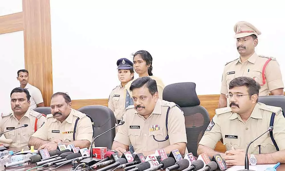 East Godavari district SP M Ravindranath Babu producing the surrendered Maoist Madakam Idumamma before the media in Kakinada on Saturday. Additional SPs K Kumar and G Krishnakanth are also seen.