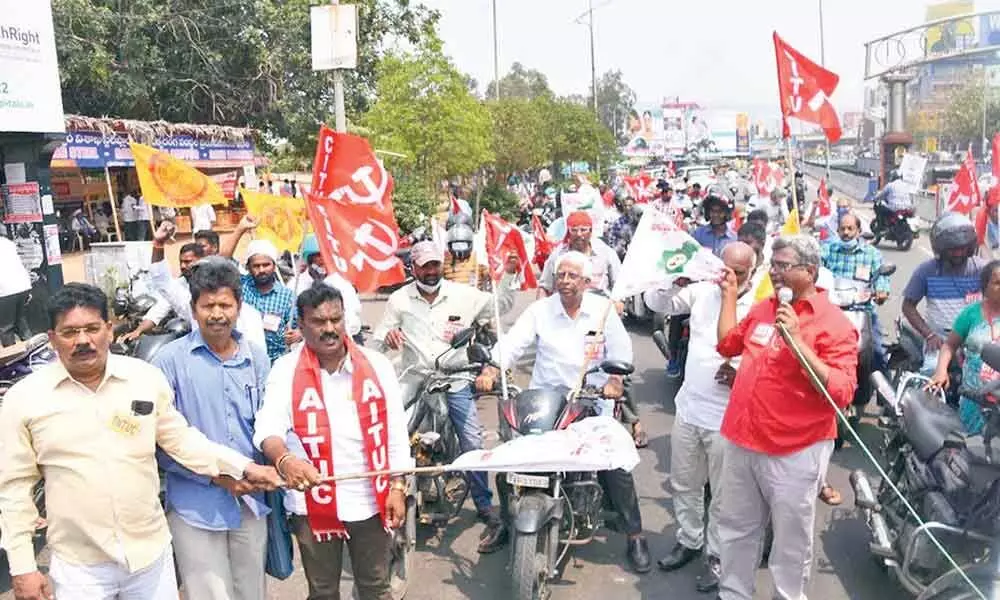 Trade union leaders taking part in the bike rally in Visakhapatnam on Saturday