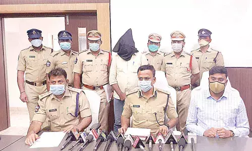 S P Senthil Kumar addresses the media on the seizure of red sanders, in Chittoor on Saturday