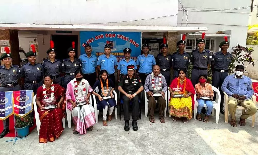 Administrative Officer, NCC Group Headquarters Col Dharmendra Pandey with family members of the 1971 Indo-Pak war heroes in Visakhapatnam on Sunday