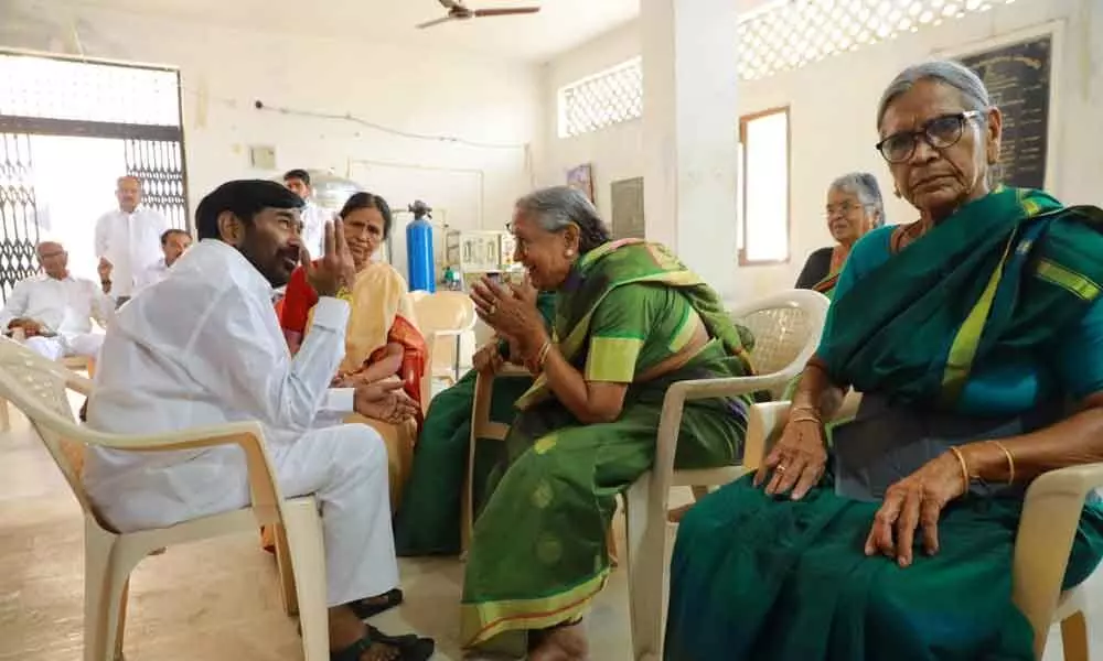 Minister Jagadish Reddy interacting with women of the ashram in Durajpally on Sunday