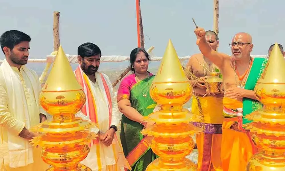Minister Jagadish Reddy along with his family participating in puja to Saptatala Rajagopuram of Yadadri temple on Monday