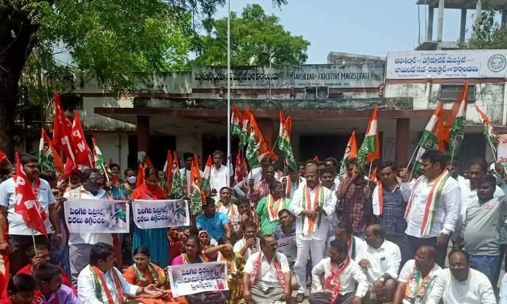 Congress and Left Party leaders staging protest at tahsildars office in Hanumakonda on Monday