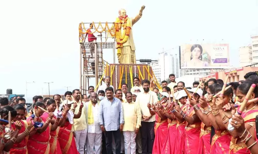 TDP leaders paying tributes to NTR statue at RK Beach in Visakhapatnam on Tuesday