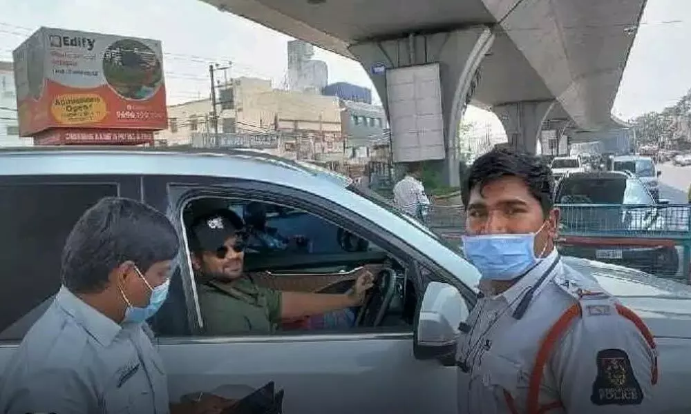 Police remove black film from tinted glass of Manoj’s car