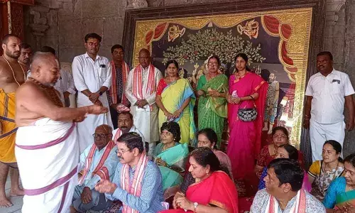 Temple main priest Narasimha Charyulu giving Veda Ashverchanam to devotees in Yadadri on Wednesday