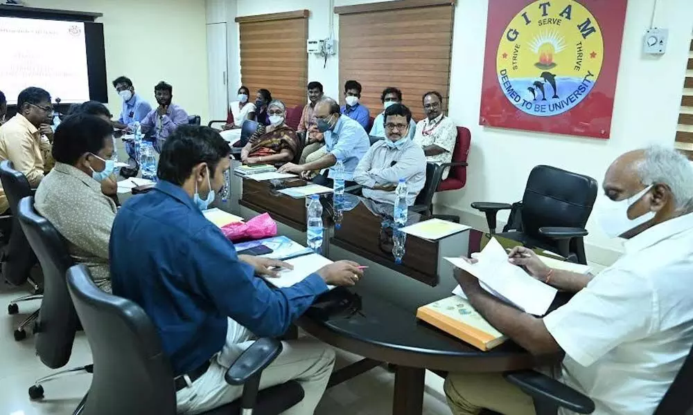 GITAM Vice Chancellor K Sivaramakrishna along with other faculty members at a review meeting in Visakhapatnam on Thursday