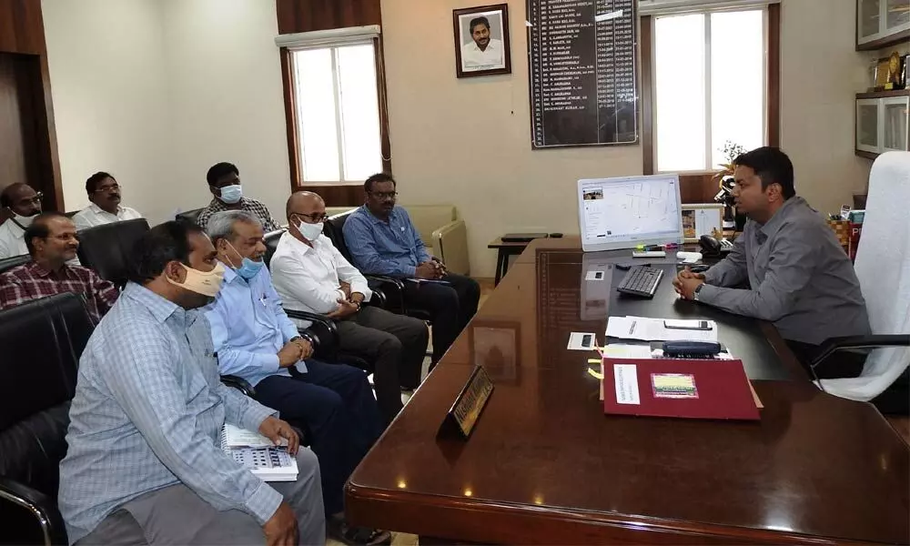 GMC Commissioner Nishanth Kumar at a meeting with KDM Engineering and Consultants Managing Director K Srinivasulu, Executive Director P Chary, Director K Srinivasa Rao and R&B Superintendent Engineer Madhavi Sukanya at his office in Guntur on Thursday
