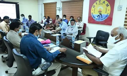 GITAM Vice Chancellor K Sivaramakrishna along with other faculty members at a review meeting in Visakhapatnam on Thursday