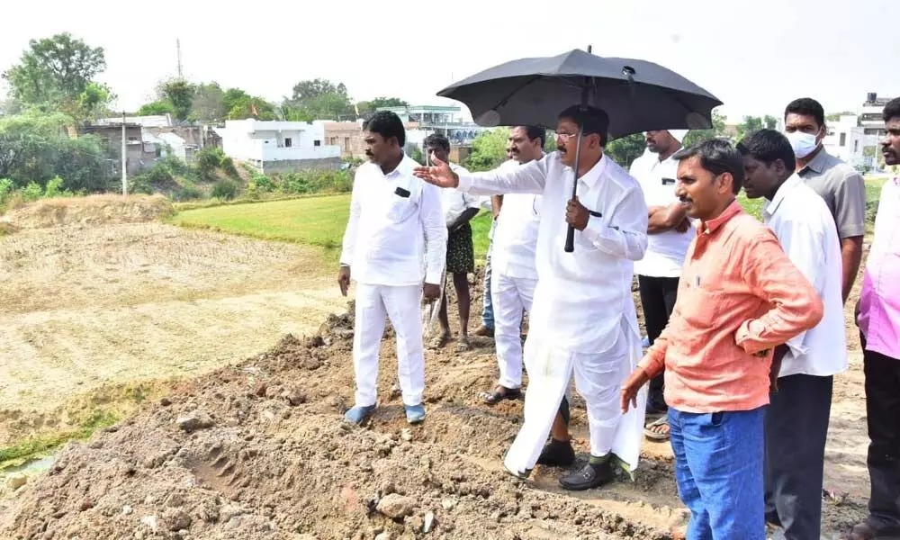Agriculture Minister Singireddy Niranjan Reddy taking stock of works of various lakes and ponds in Wanaparthy district