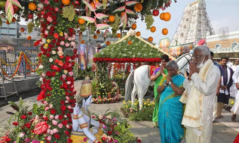 TTD chairman Y V Subba Reddy and his wife worship deities amid stunning flower decorations opposite Sri Venkateswara temple in Tirumala on Saturday