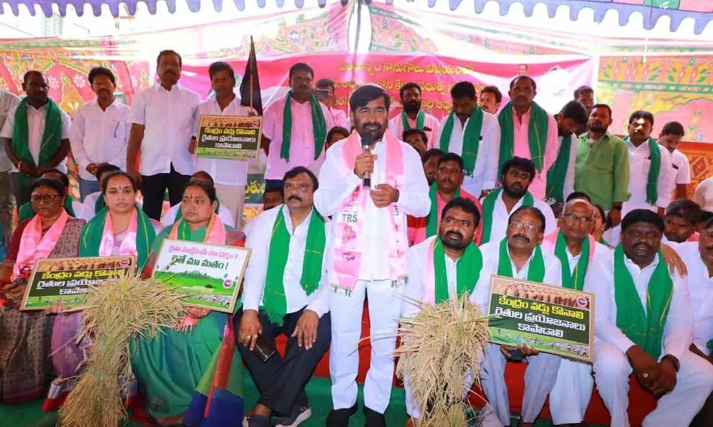 Energy Minister Jagadish Reddy addressing the gathering during a protest against the Central government in Suryapet on Monday