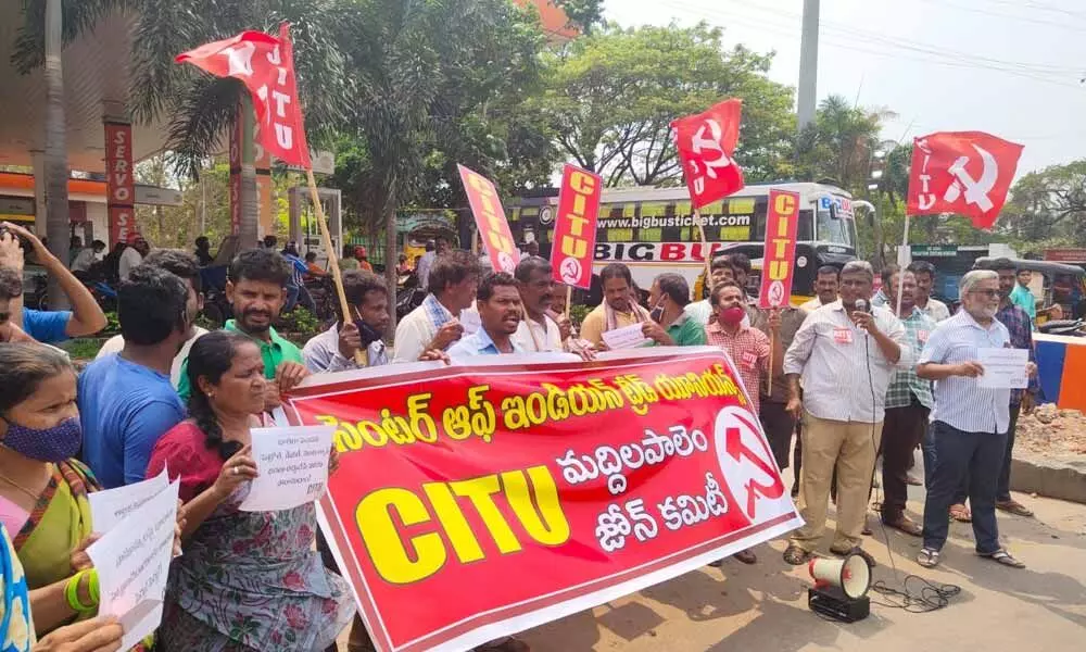 CITU leaders, auto rickshaw and construction workers staging a protest in Visakhapatnam on Monday