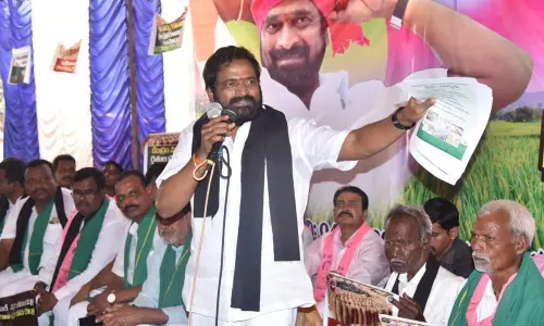 Minister V Srinivas Goud addressing protesters held in Mahabubnagar district headquarters on Monday