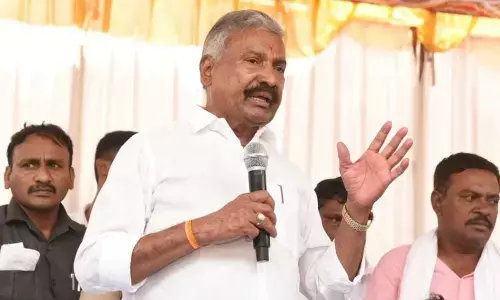 Panchayat Raj Minister Peddireddi Ramachandra Reddy addressing a public meeting at Kanduru in Somala mandal on Monday
