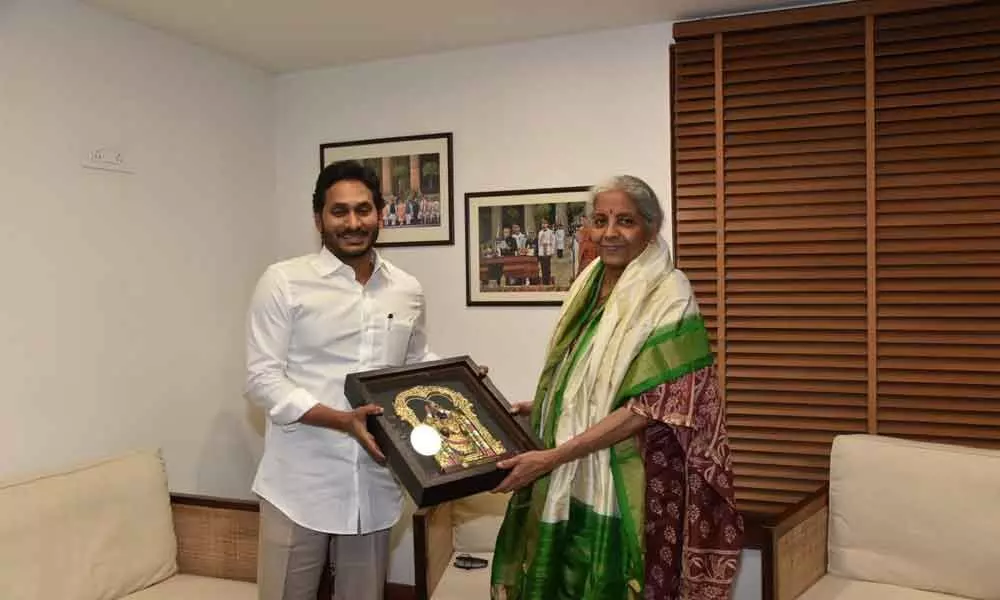Chief Minister Y S Jagan Mohan Reddy presents a photo of Lord Sri Venkateswara to Union finance minister Nirmala Sitharaman during their meeting in New Delhi on Tuesday