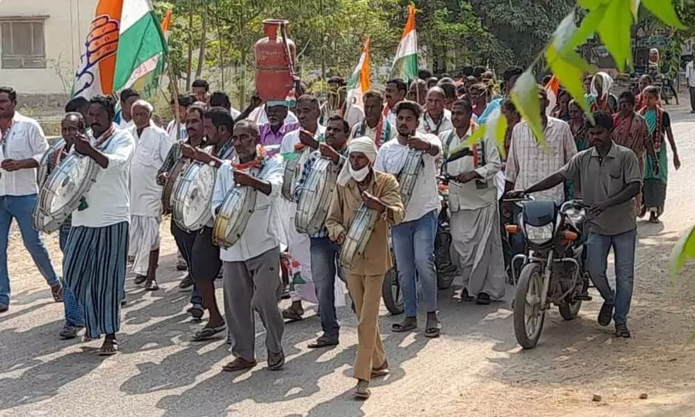 Congress leaders holding a dharna against fuel price hike in Ergatla mandal on Tuesday