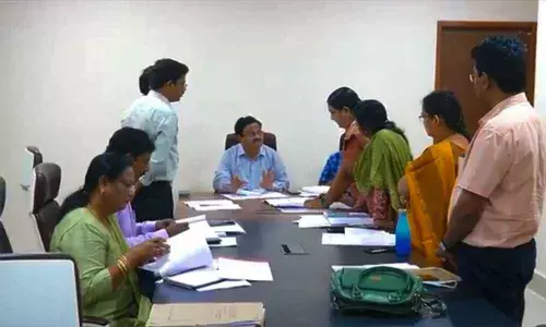 Tirupati Collector K Venkata Ramana Reddy holding a meeting with officials of APIIC, revenue and survey departments in Tirupati on Tuesday