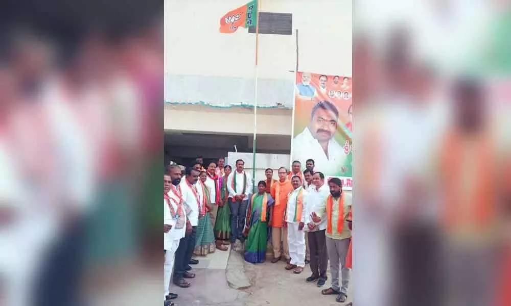 BJP leaders hoisting the party flag in Mahbubnagar on Wednesday
