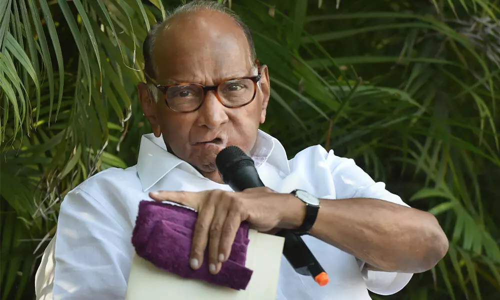 NCP chief Sharad Pawar addresses the media during a press conference at his residence, in New Delhi on Wednesday