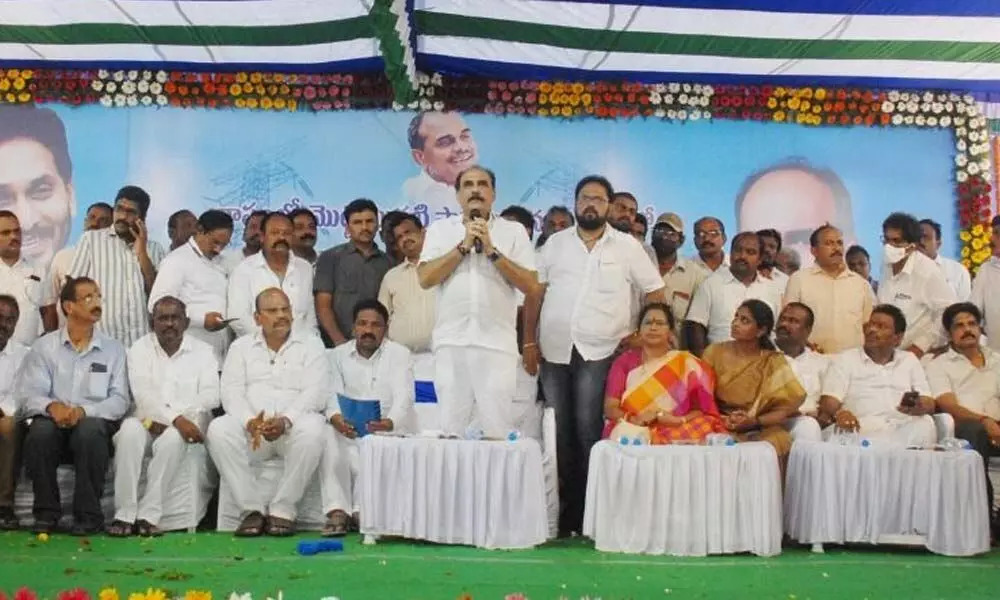 Minister Balineni Srinivasa Reddy speaking at a public meeting in Ongole on Wednesday