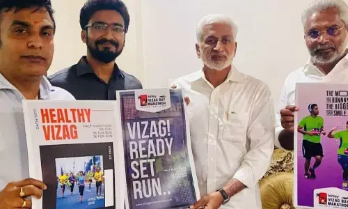 MP  V Vijayasai Reddy unveiling a poster and a website of the Bay Marathon along with the organisers in Visakhapatnam on Wednesday