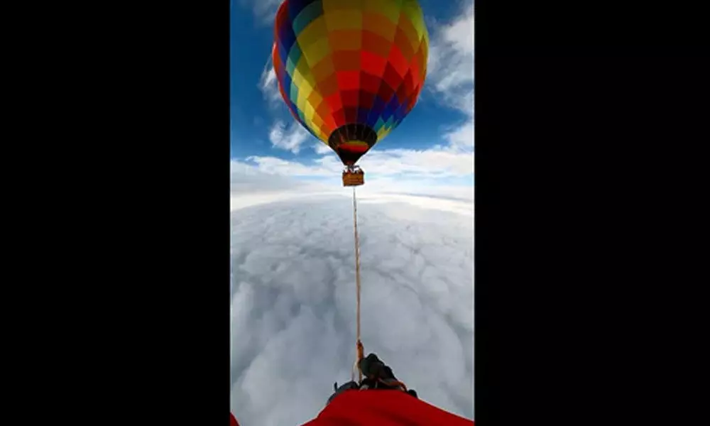 Man Set A New Guinness World Record For Walking On A Rope Linked Between Two Hot Air Balloons