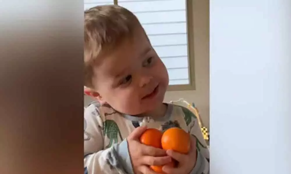 Baby sings a song about oranges and clementines.