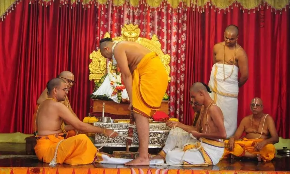 Priests conducting  Agnipratista at Lord Rama temple in Bhadrachalam on Friday