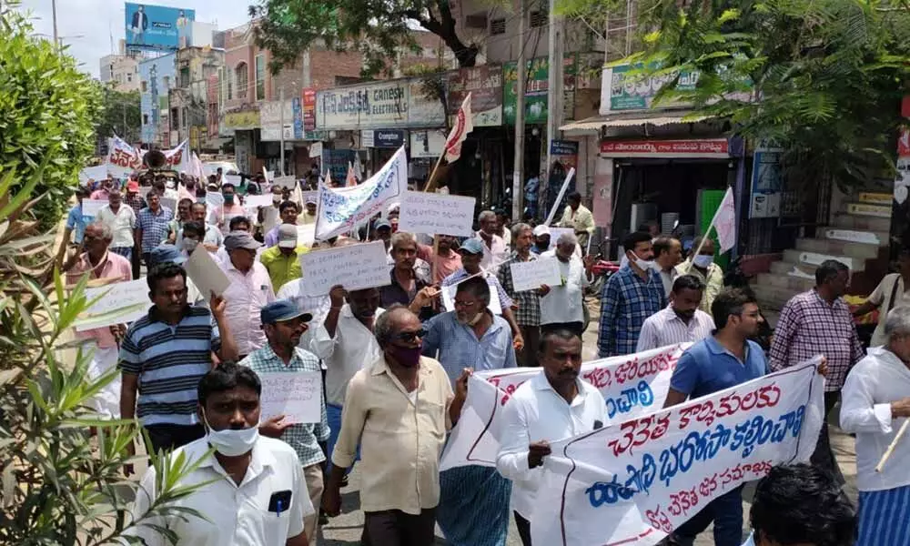 Handloom weavers and workers taking out a rally in Chirala on Friday