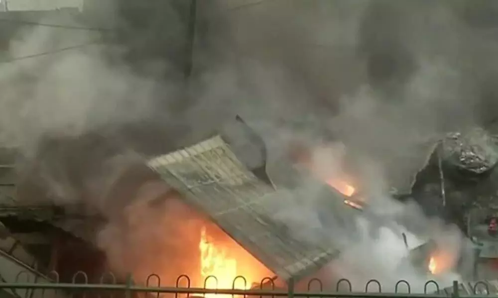 Delhi: Fire breaks out in five shops in Azad market area.(ANI)