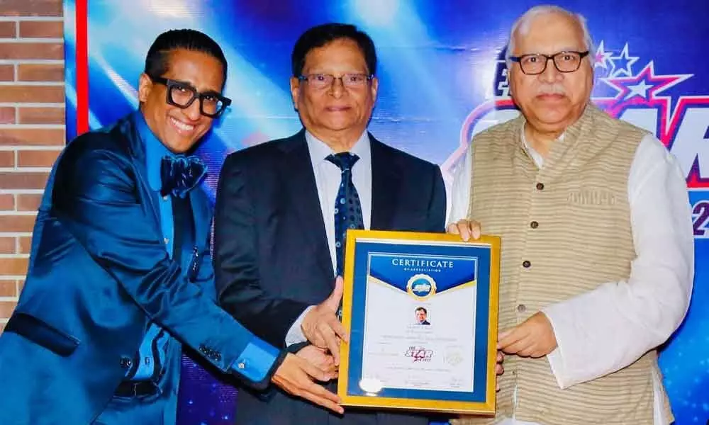 Prof V C Rao receiving Most Impactful Vice-Chancellor award in New Delhi on Saturday