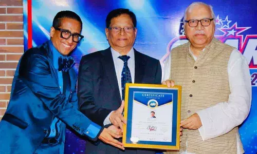 Prof V C Rao receiving Most Impactful Vice-Chancellor award in New Delhi on Saturday