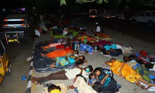 Devotes sleeping in queue line at Bhudevi complex in Tirupati