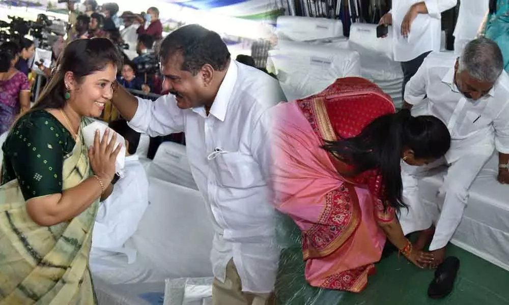 Outgoing Deputy Chief Minister Pamula Pushpasreevani greets minister Botcha Satyanarayana at the swearing-in of new ministers at the Secretariat on Monday. (Right) New minister R K Roja touches the feet of Peddireddi Ramachandra Reddy after taking oath on Monday