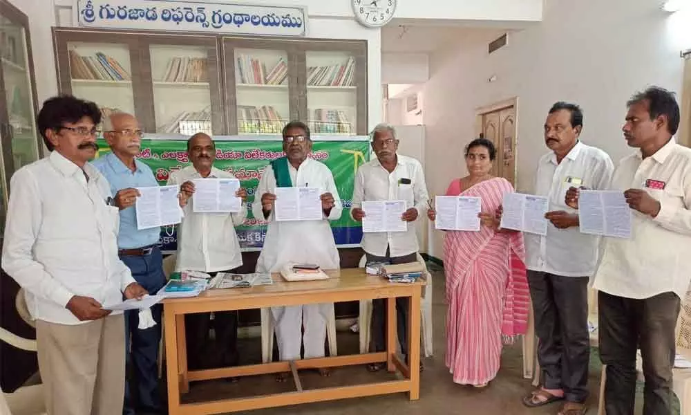 Farmers leaders releasing a pamphlet on the importance of social forestry translated by Chunduri Ranga Rao in Ongole on Monday