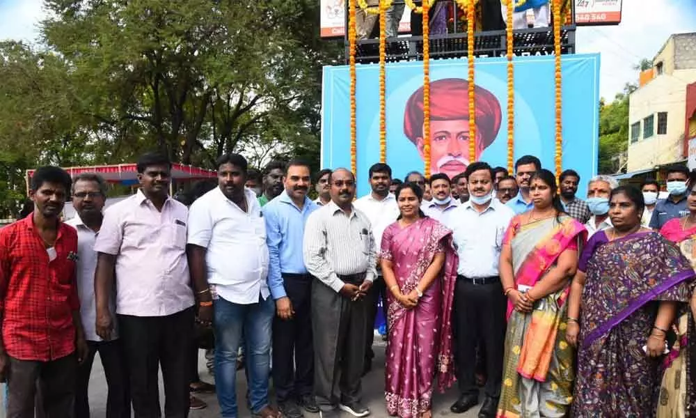District Collector K Venkata Ramana Reddy and Mayor Dr R Sirisha after garlanding Jyothirao Phule statue  at Balaji Colony Circle in Tirupati on Monday