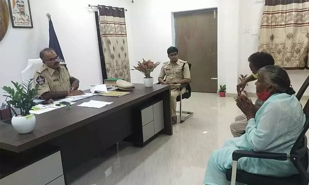 Superintendent of Police KSSV Subba Reddy listening to the petitioners during Spandana programme at his office in Amalapuram on Monday