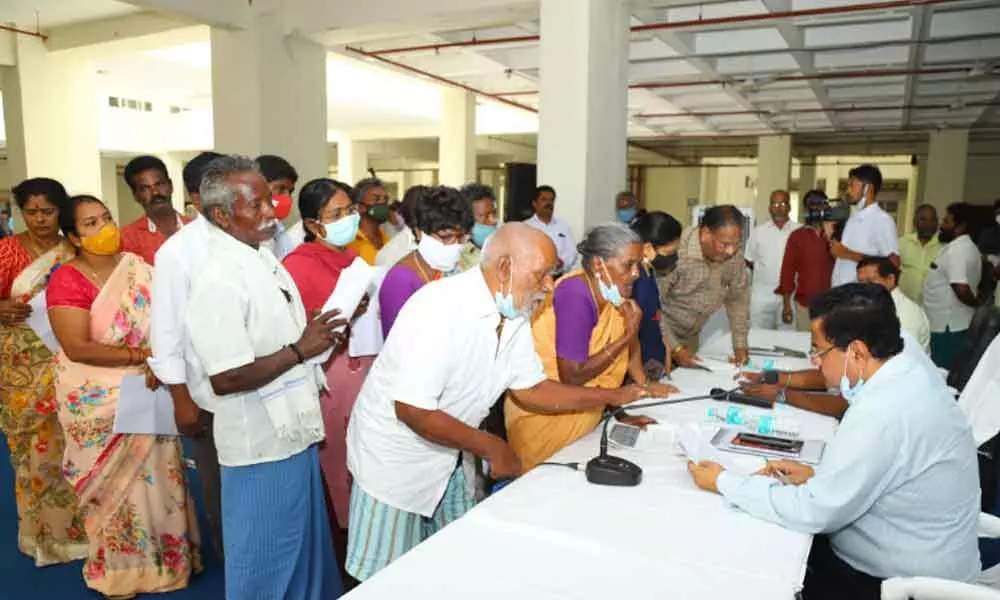 An aged couple S C Raj and his wife Sarojamma submitting a representation to the District Collector at the Spandana programme in Tirupati on Monday