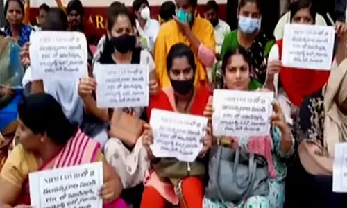 DMHO staff holds dharna, demands govt to renew contract