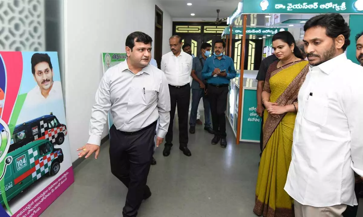 Chief Minister Y S Jagan Mohan Reddy inspecting the display boards of the Health Department at his camp office in Tadepalli on Tuesday. Health Minister V Rajini is also seen