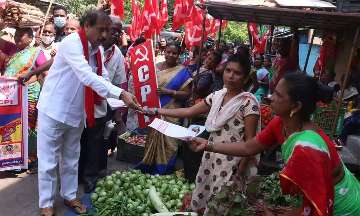 CPI (M) state secretary K Ramakrishna distributing pamphlets in Visakhapatnam on Tuesday