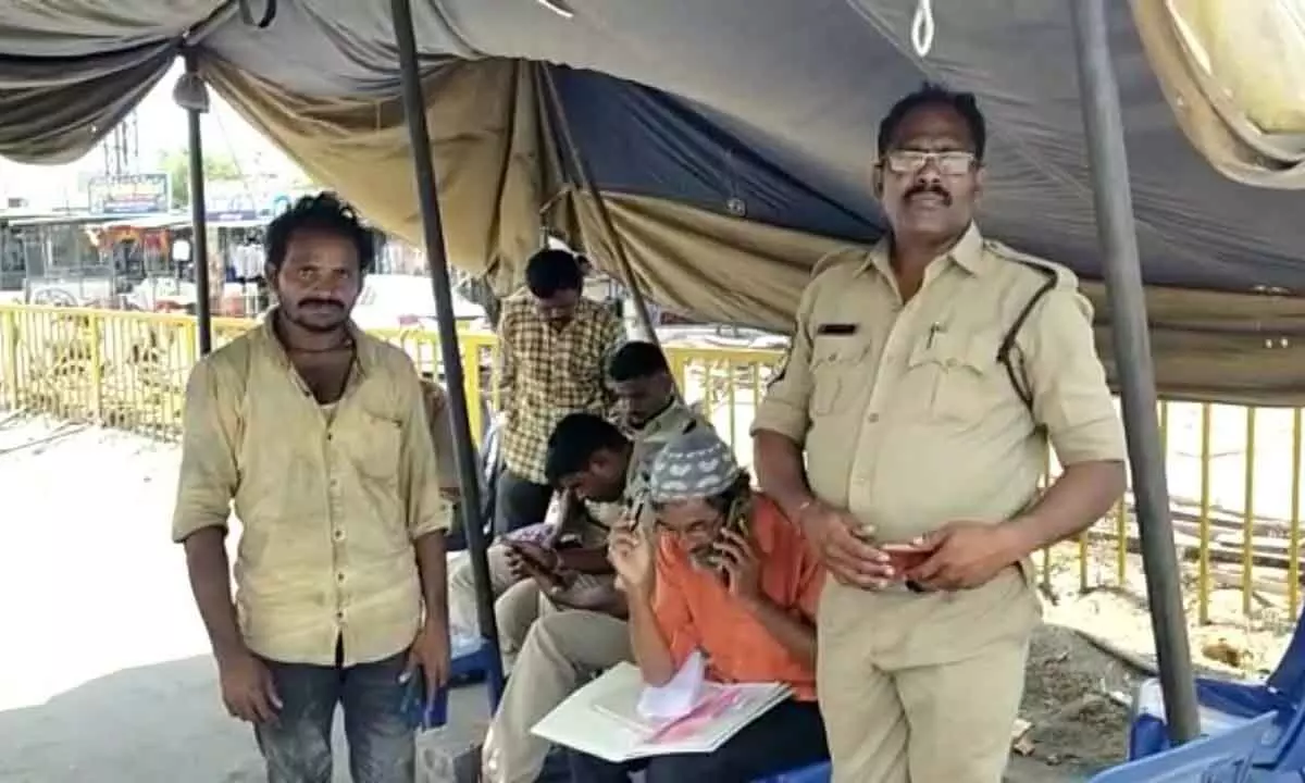 Police and revenue staff at AP-TS border Ramapuram cross roads of Kodad in Suryapet district on Thursday